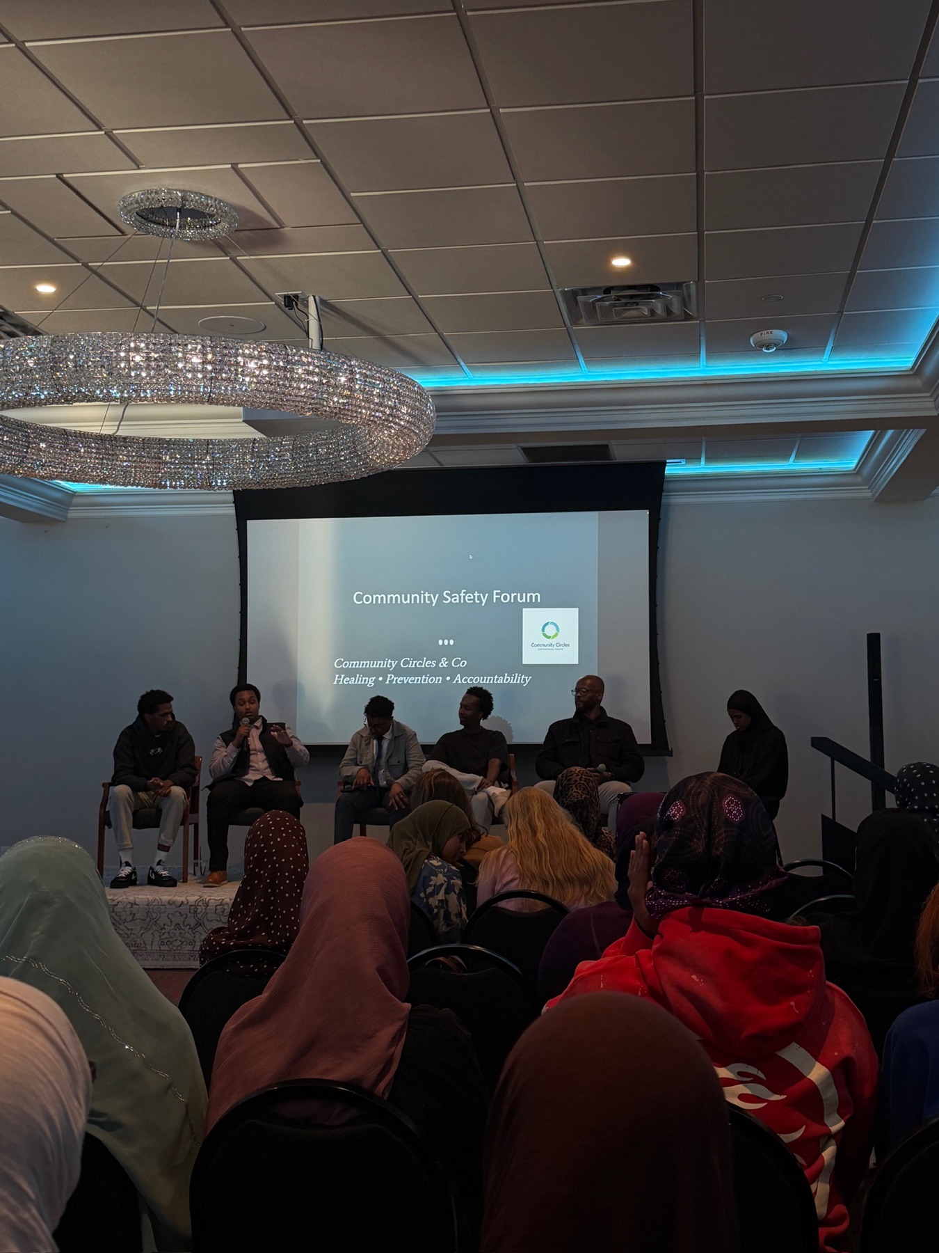 Community members in conversation at a Community Safety Forum